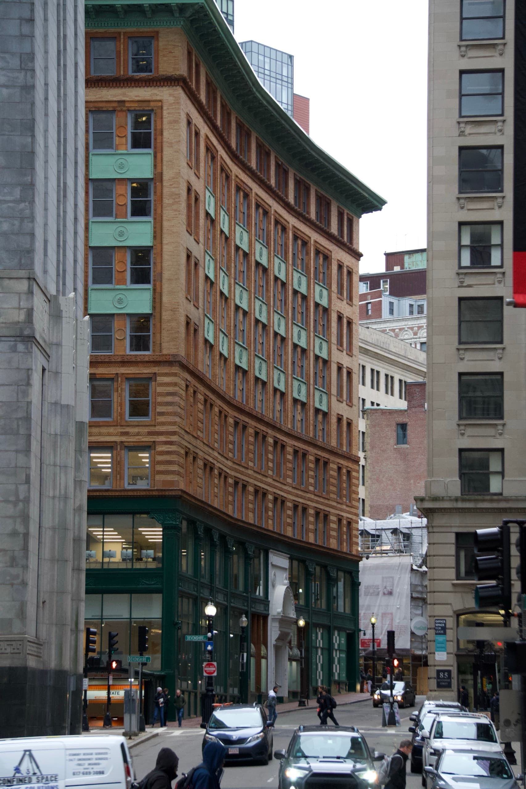 Tall brick and stone buildings lining a city street